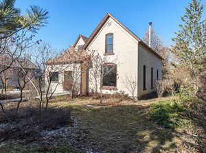 Front of the property features mature trees and original brick.