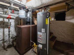 Utility room featuring gas water heater