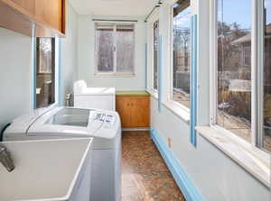 Laundry room with plenty of natural light and washer and dryer