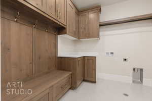 Laundry room featuring washer hookup, cabinets, and hookup for an electric dryer