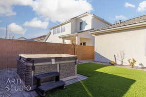 View of yard with a hot tub