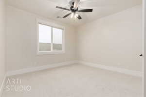 Empty room featuring ceiling fan and carpet flooring