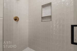 Bathroom with tiled shower