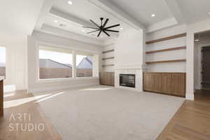 Unfurnished living room with ceiling fan and light hardwood / wood-style floors