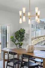 Dining space with hardwood / wood-style flooring and plenty of natural light