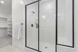 Bathroom featuring a shower with shower door