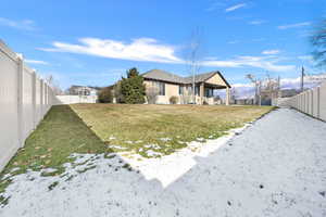 View of yard covered in snow