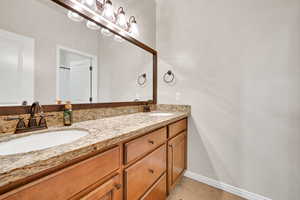 Bathroom featuring vanity and tile patterned floors