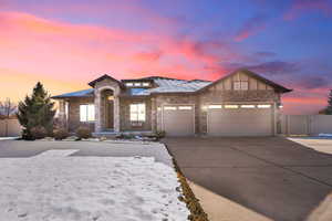 View of front of property featuring a garage