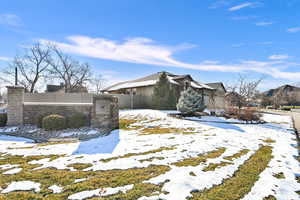 View of snow covered property