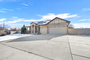 View of front of house with a garage and a mountain view