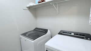 Laundry area featuring independent washer and dryer