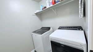 Laundry room featuring washer and clothes dryer