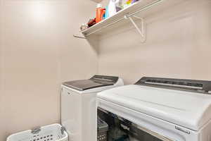 Laundry area with washing machine and clothes dryer