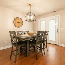 Dining area featuring wood finished floors and baseboards