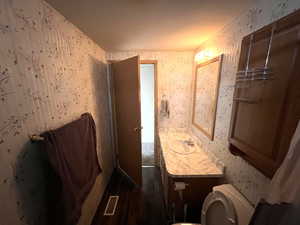 Bathroom featuring toilet and vanity