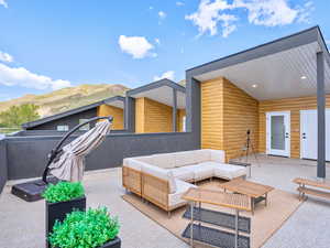 View of patio / terrace with an outdoor hangout area and a mountain view