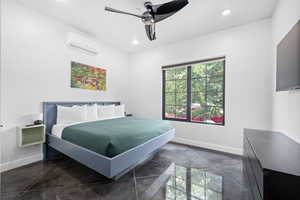 Bedroom featuring ceiling fan and a wall unit AC