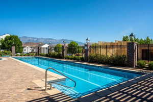 View of swimming pool featuring a mountain view and a patio area