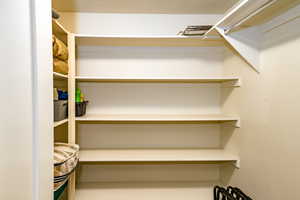 upstairs apartment over detached garage: View of walk in closet in hallway to bathroom.