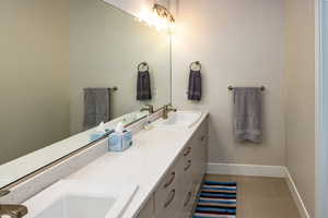 Full Bathroom featuring vanity and tile patterned floors