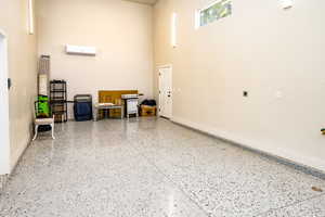 Detached RV Garage featuring epoxy flooring and wall unit AC