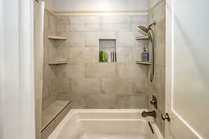 Full Bathroom with shower / bathtub combination with curtain