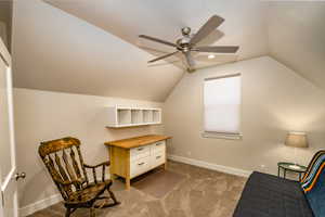 Bedroom 4 featuring ceiling fan, a textured ceiling, vaulted ceiling, and dark colored carpet