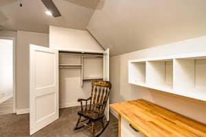 Bedroom 4 spacious closet with lofted ceiling and dark colored carpet