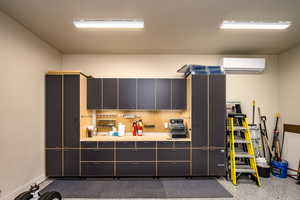 Detached 2 car tandem garage with workbench and AC wall unit