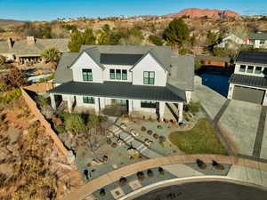 View of front of property with a mountain view and a garage