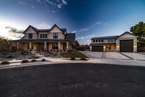 View of front of property with covered porch and solar panels