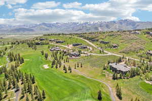 Drone / aerial view of mountains and a local golf course