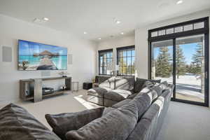 Living room featuring light colored carpet