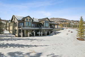 View of front of house with a balcony and a mountain view