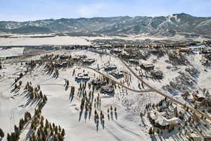 Snowy aerial view with a mountain view