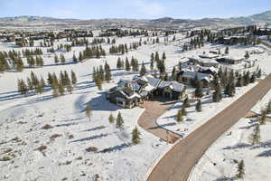 Snowy aerial view featuring a mountain view