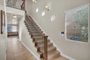 Staircase featuring tile patterned flooring