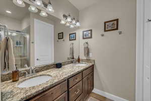 Bathroom with walk in shower and vanity