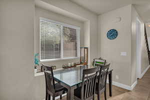 Dining area featuring light tile patterned floors