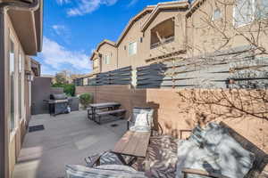 View of patio featuring a grill