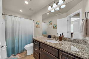 Bathroom with toilet and vanity