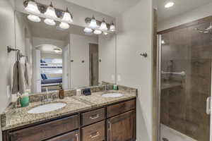 Bathroom featuring vanity and walk in shower