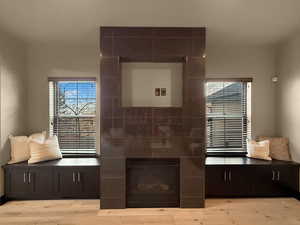 Bathroom with hardwood / wood-style flooring and a healthy amount of sunlight