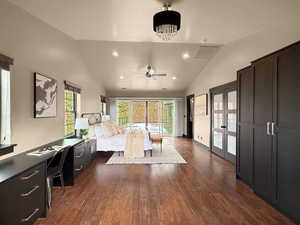 Bedroom with access to outside, dark hardwood / wood-style flooring, lofted ceiling, and a chandelier