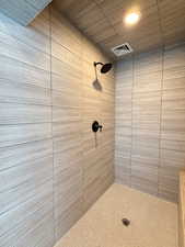 Bathroom featuring a tile shower