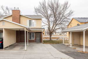 View of patio with a carport