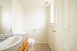 Bathroom featuring toilet and vanity