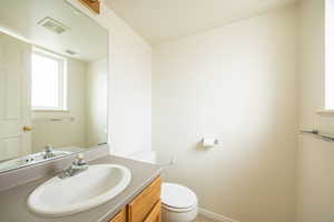 Bathroom with toilet and vanity