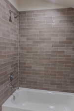 Bathroom with tiled shower / bath